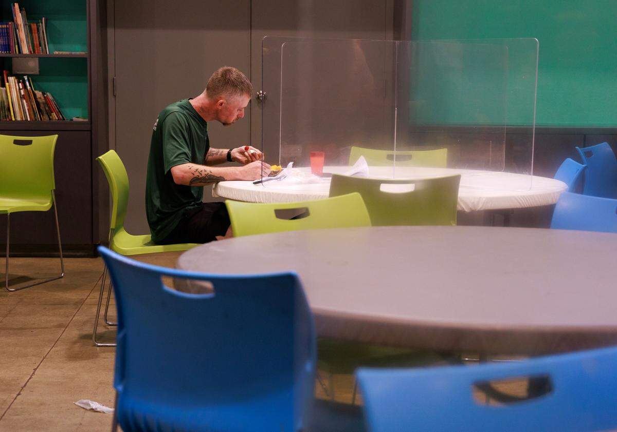 Coty Dawson eats dinner at Urban Ministries of Durham’s community cafe on Wednesday, May 14, 2025.