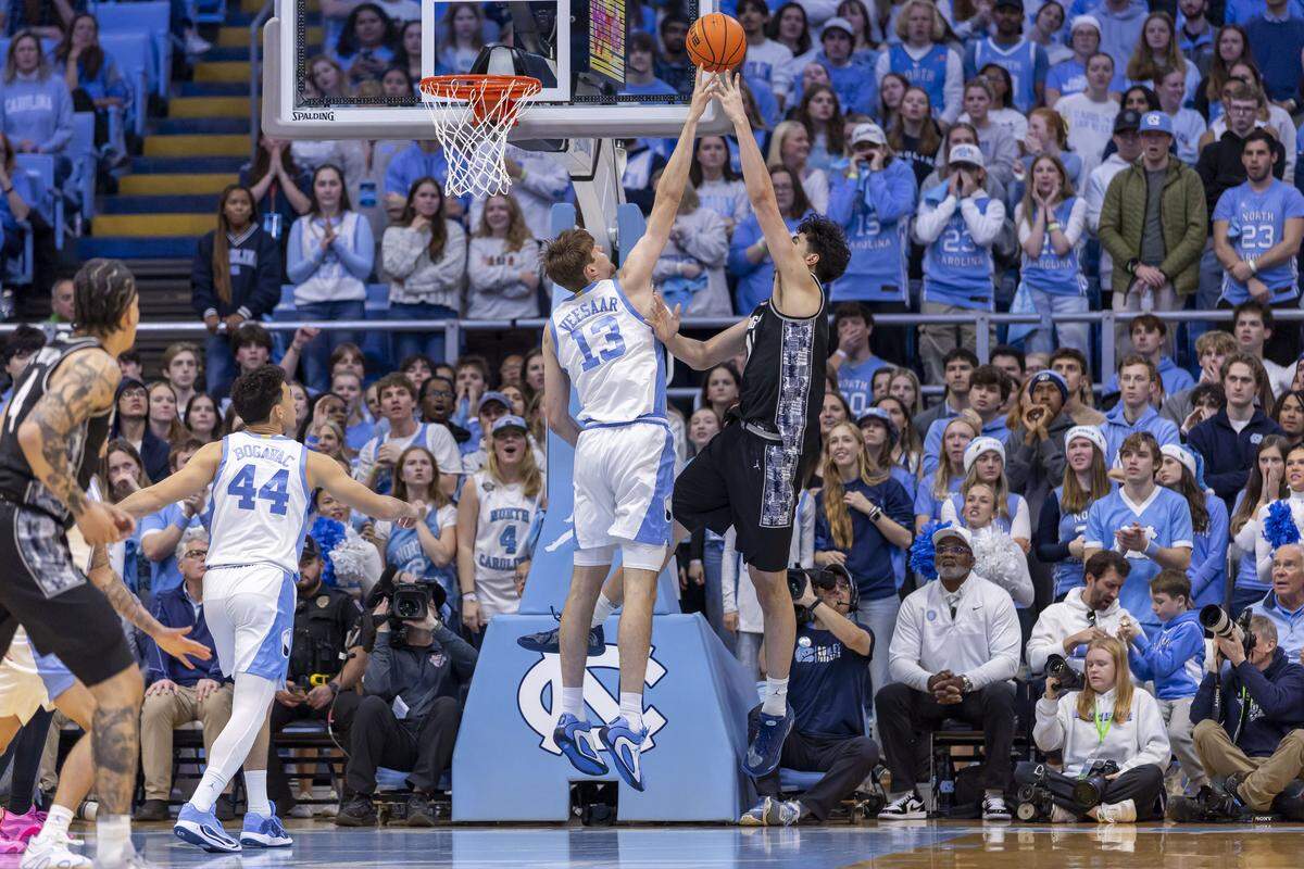North Carolina center Henri Veesaar (13) defends Georgetown center Julius Halaifonua (11) the first half on Sunday, December 7, 2025 at the Smith Center in Chapel Hill, N.C.   