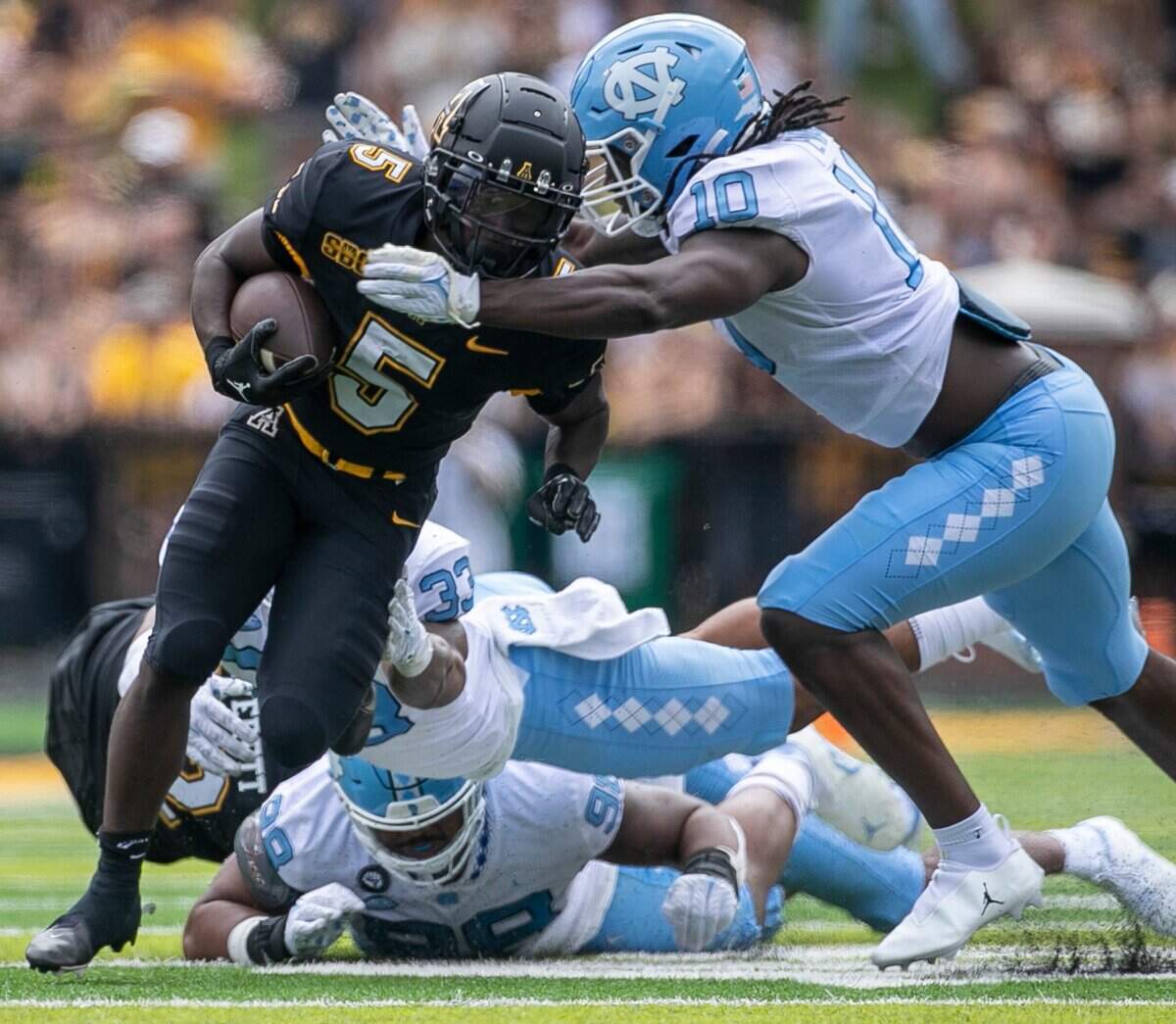 North Carolinas Desmond Evans (10) stops Appalachian States Nate Noel (5) in the second quarter on Saturday, September 3, 2022 at Kidd Brewer Stadium in Boone, N.C