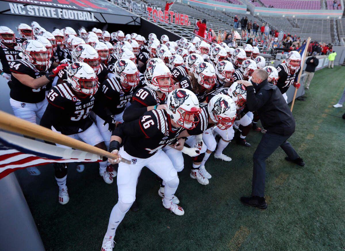 N.C. State head coach Dave Doeren gets ready to lead his team onto the field before N.C. State’s game against Georgia Tech at Carter-Finley Stadium in Raleigh, N.C., Saturday, Dec. 5, 2020.