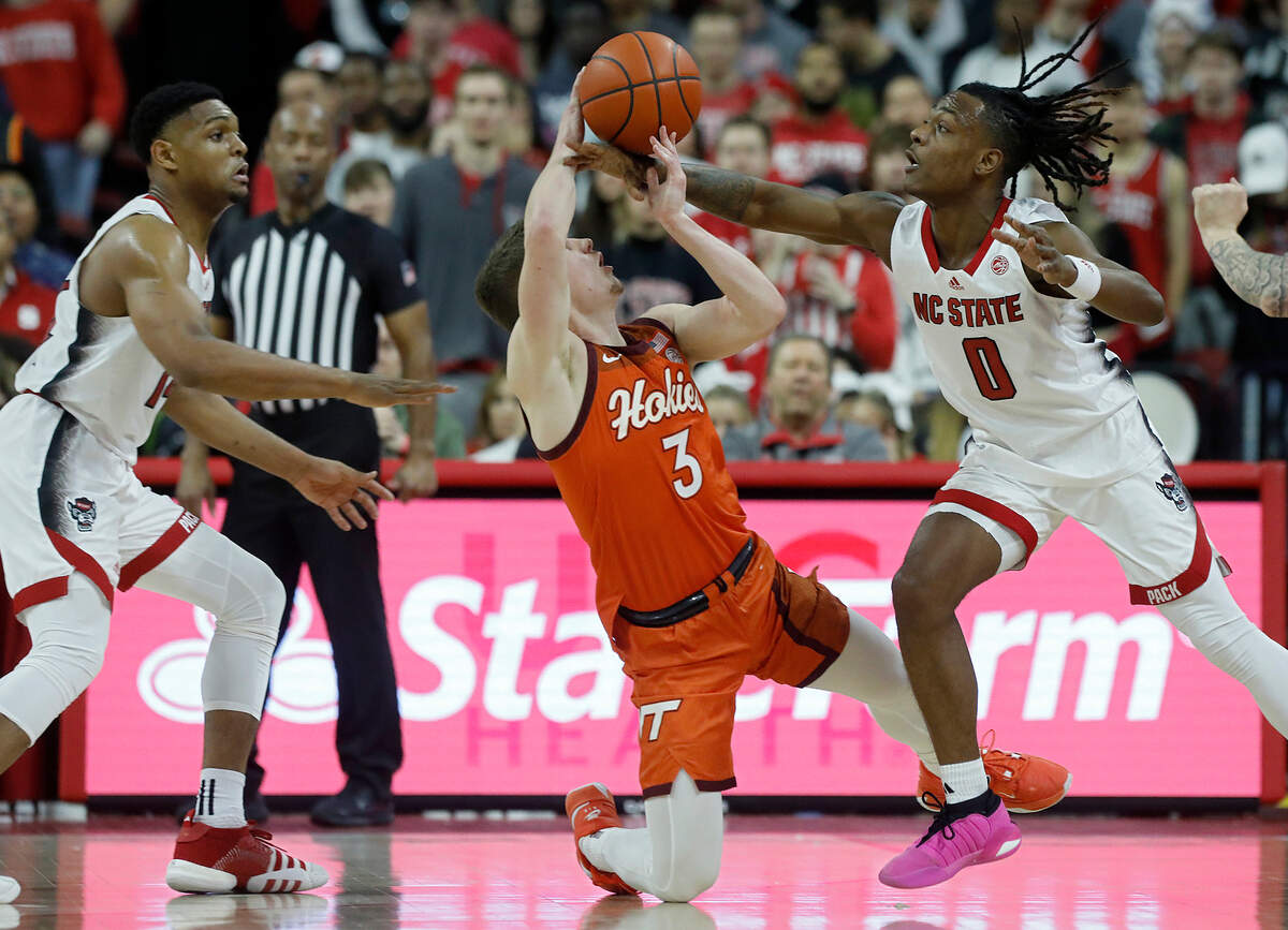 N.C. State’s DJ Horne causes Virginia Tech’s Sean Pedulla to turn the ball over during the second half of the Wolfpack’s 84-78 loss on Saturday, Jan. 20, 2024, at PNC Arena in Raleigh, N.C.