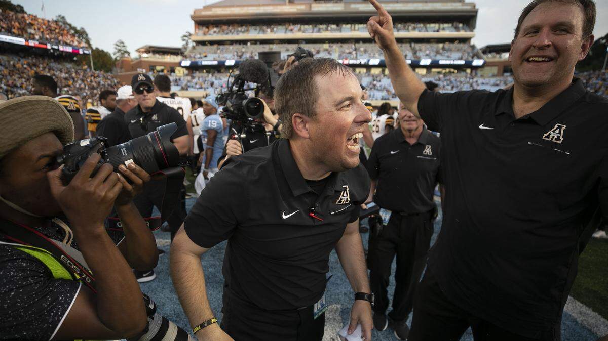 Appalachian State head coach Eliah Drinkwitz celebrates the Mountaineers’ 34-31 victory over North Carolina on Saturday, September 21, 2019 at Kenan Stadium in Chapel Hill, N.C.