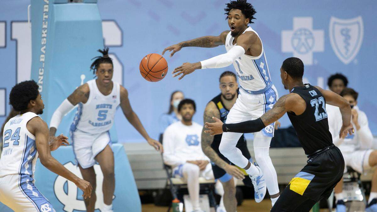 North Carolina’s Leaky Black (1) breaks up a pass by Marquette’s Jamal Cain (23) during the first half on Wednesday, February 24, 2021 at the Smith Center in Chapel Hill, N.C.