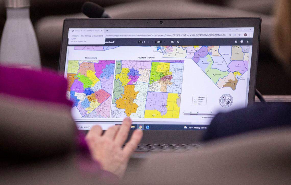 Congressional maps can be seen on the computer screen of Rep. Rachel Hunt before the start of a House committee meeting on redistricting at the Legislative Office Building in Raleigh, N.C. on Wednesday, Feb. 16, 2022.
