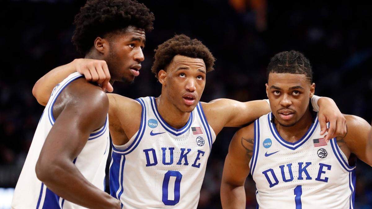 Dukes AJ Griffin (21), Wendell Moore Jr. (0) and Trevor Keels (1) huddle after a timeout during the second half of Dukes 78-69 victory over Arkansas in the NCAA Tournament West Regional finals at the Chase Center in San Francisco, Calif., Saturday, March 26, 2022.