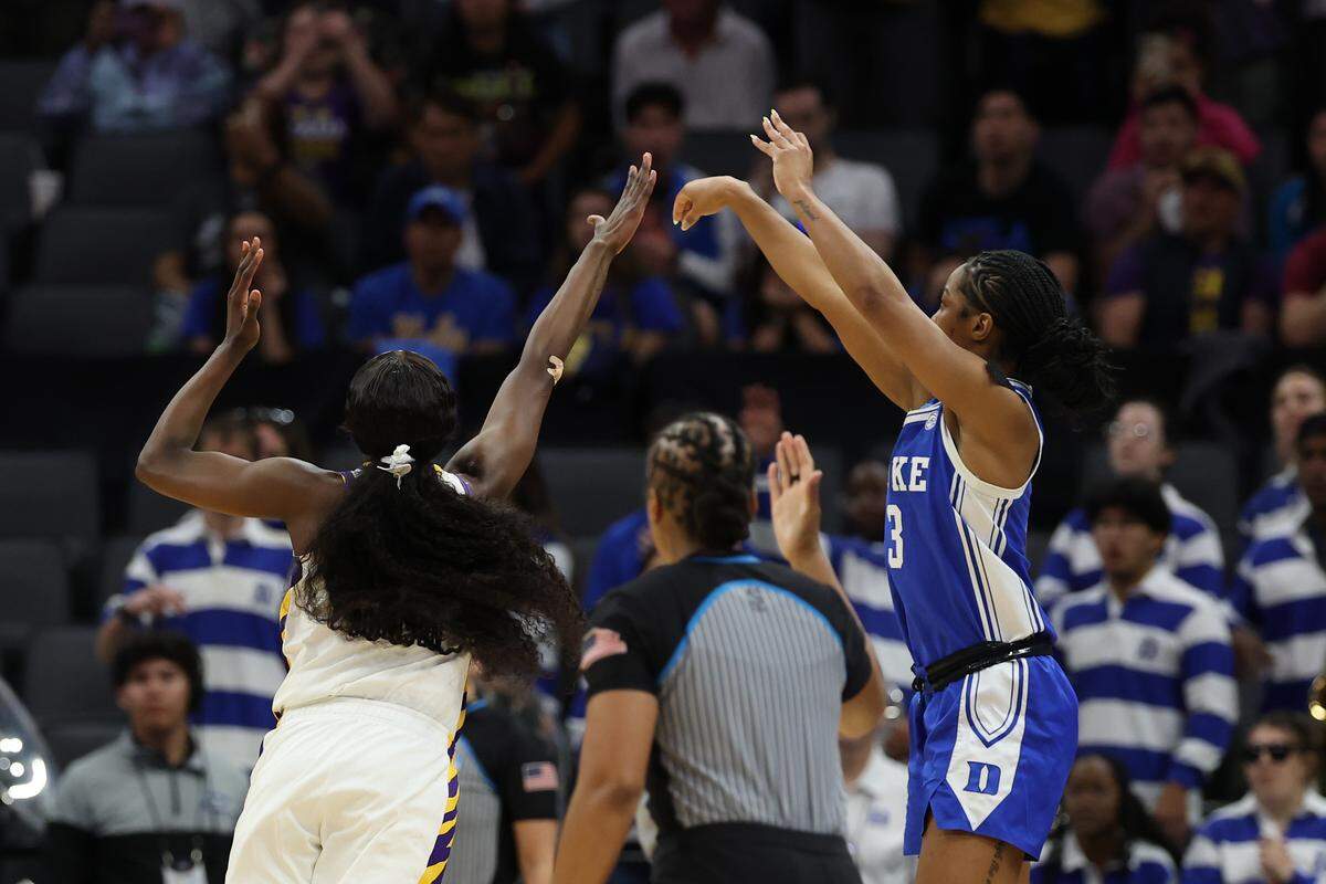 Ashlon Jackson, right, of the Duke Blue Devils takes a shot over Flau'jae Johnson of LSU at the end of the teams’ 2026 NCAA Women’s Basketball Tournament Sweet 16 game at Golden 1 Center on March 27, 2026 in Sacramento, California.