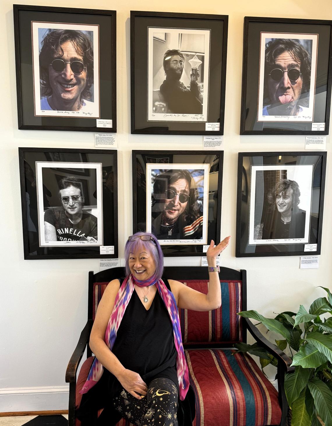 May Pang, John Lennon’s former girlfriend and personal assistant to the Beatles star and his wife Yoko Ono, poses with some of the photos she took during her 18-month, live-in relationship with Lennon in the 1970s.