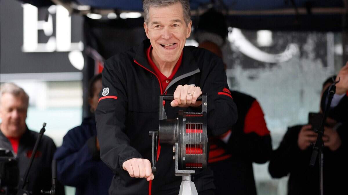N.C. Governor Roy Cooper prepares to crank the warning siren to kickoff the Carolina Hurricanes Fan Fest in downtown Raleigh in 2023.