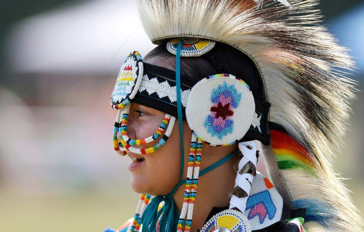 Jasmine Jacobs of Pembroke, a member of the Waccamaw Siouan Tribe, waits to participate in a switch dance during the Dix Park Inter-Tribal Pow Wow in Raleigh, N.C., Saturday, August 26, 2023.