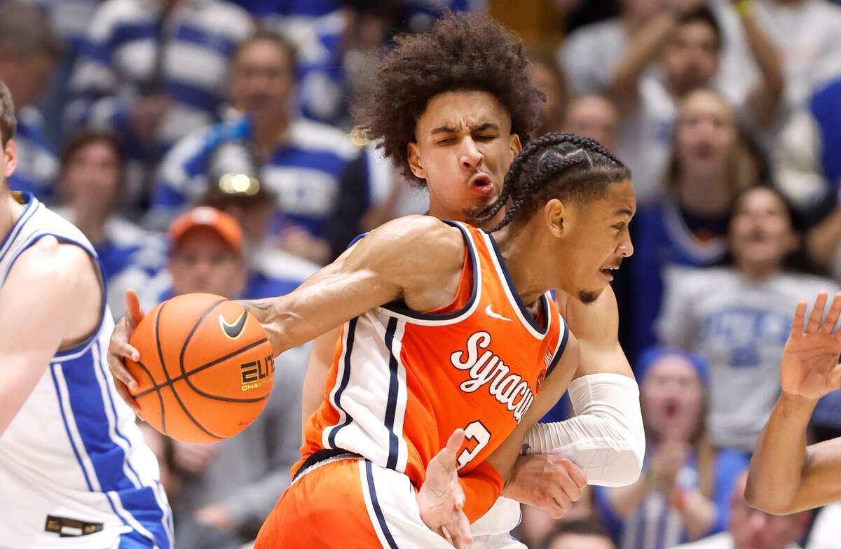 Duke’s Tyrese Proctor (5) defends Syracuse’s Judah Mintz (3) during the second half of Duke’s 86-66 victory over Syracuse at Cameron Indoor Stadium in Durham, N.C., Tuesday, Jan. 2, 2024.
