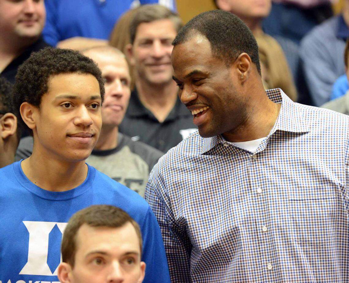 NBA former player David Robinson (right) and son Justin Robinson watch introductions prior to the first half between the Notre Dame Fighting Irish and Duke Blue Devils at Cameron Indoor Stadium on Feb. 7, 2015.
