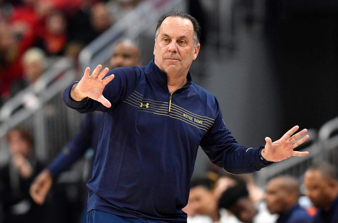 Notre Dame head coach Mike Brey sends instructions to his team during the second half of an NCAA college basketball game against Louisville in Louisville, Ky., Saturday, Jan. 22, 2022. Notre Dame won 82-70.