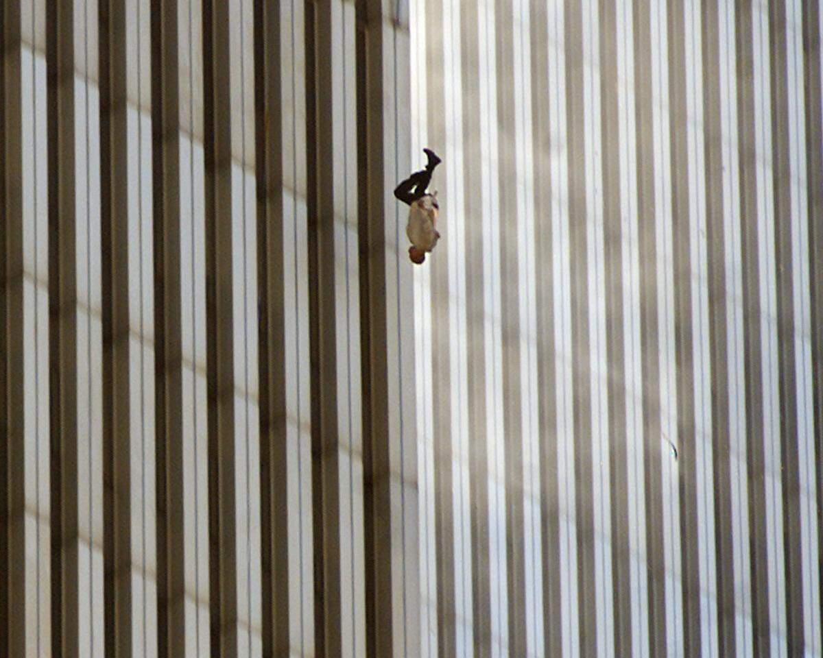 A person falls from the north tower of New York’s World Trade Center in this Sept. 11, 2001 file photo, after terrorists crashed two hijacked airliners into the World Trade Center.