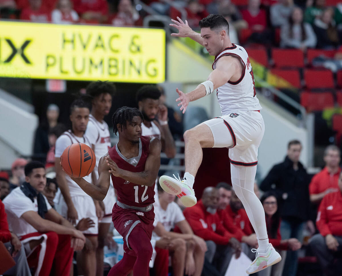 N.C. State’s Michael O’Connell pressures Rider’s Andre Young during the first half of the Wolfpack’s 89-63 win on Sunday, Dec. 22, 2024, at Lenovo Center in Raleigh, N.C.