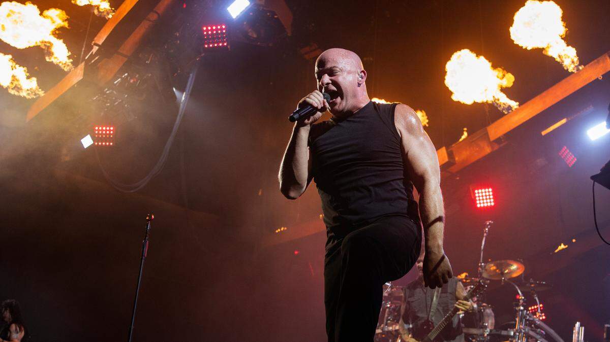 Flames light the stage as Disturbed lead singer David Draiman works the edge on their “Take Back Your Life Tour” to Raleigh, N.C.’s Coastal Credit Union Music Park at Walnut Creek, Wednesday night, Sept. 6, 2023.