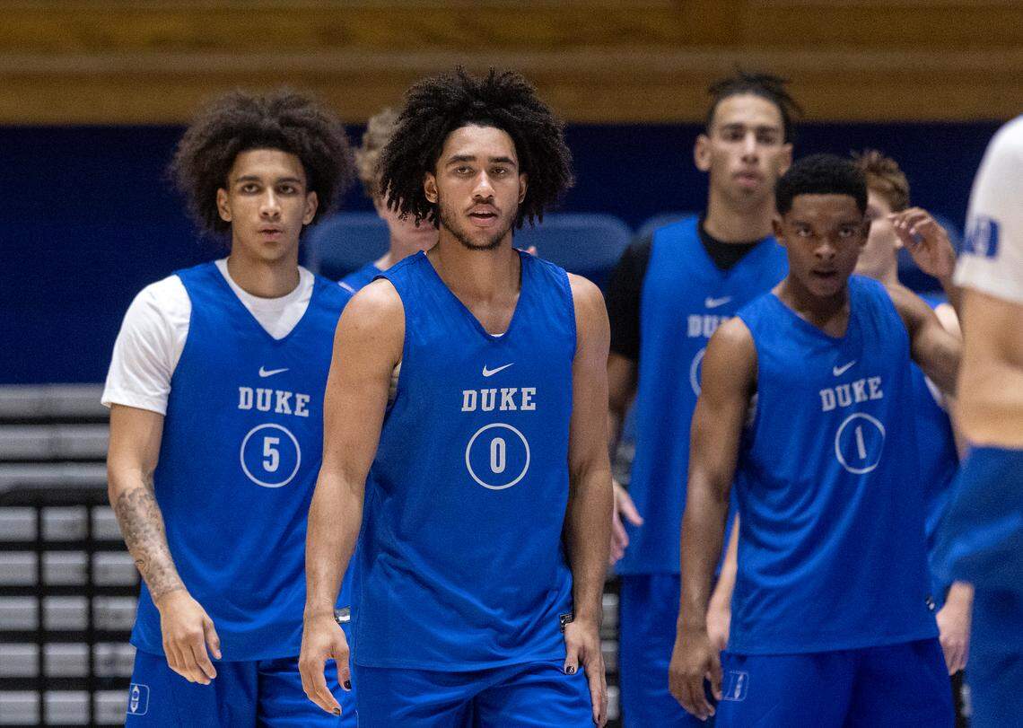 Duke’s Tyrese Proctor, Jared McCain and Caleb Foster listen to instructions during a practice on Friday, Sept. 29, 2023, at Cameron Indoor Stadium in Durham, N.C.