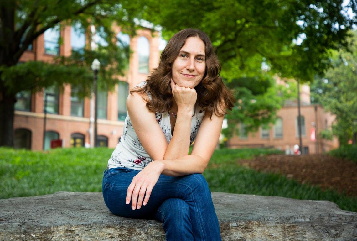 Katie Mack, an astrophysicist and assistant professor of physics at N.C. State University sits for a portrait on campus, on Monday, July 12, 2021, in Raleigh, N.C.