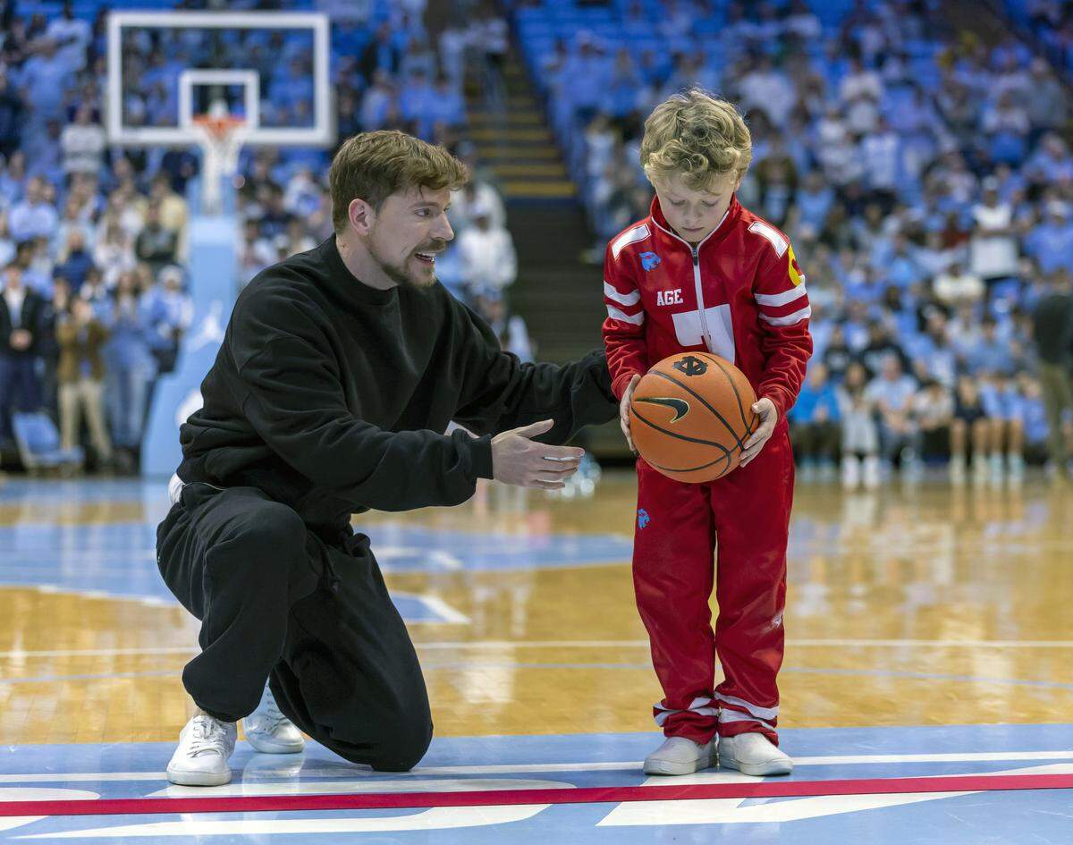 Jimmy Donaldson, the YouTube Influencer know as MrBeast, instructs contestant, seven-year-old Gunner Phillips of Cary, during a contest for $250,000 on Saturday , December 13, 2025 at the Smith Center in Chapel Hill, N.C.