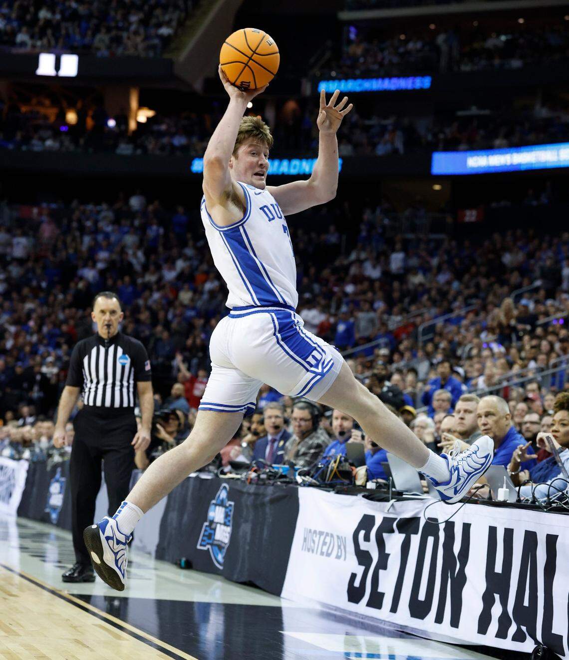 Duke’s Kon Knueppel (7) saves the ball from going out of bounds during the first half of Duke’s game against Alabama in their Elite 8 game in the 2025 NCAA Men’s Basketball Championship at the Prudential Center in Newark, N.J., Saturday, March 29, 2025.