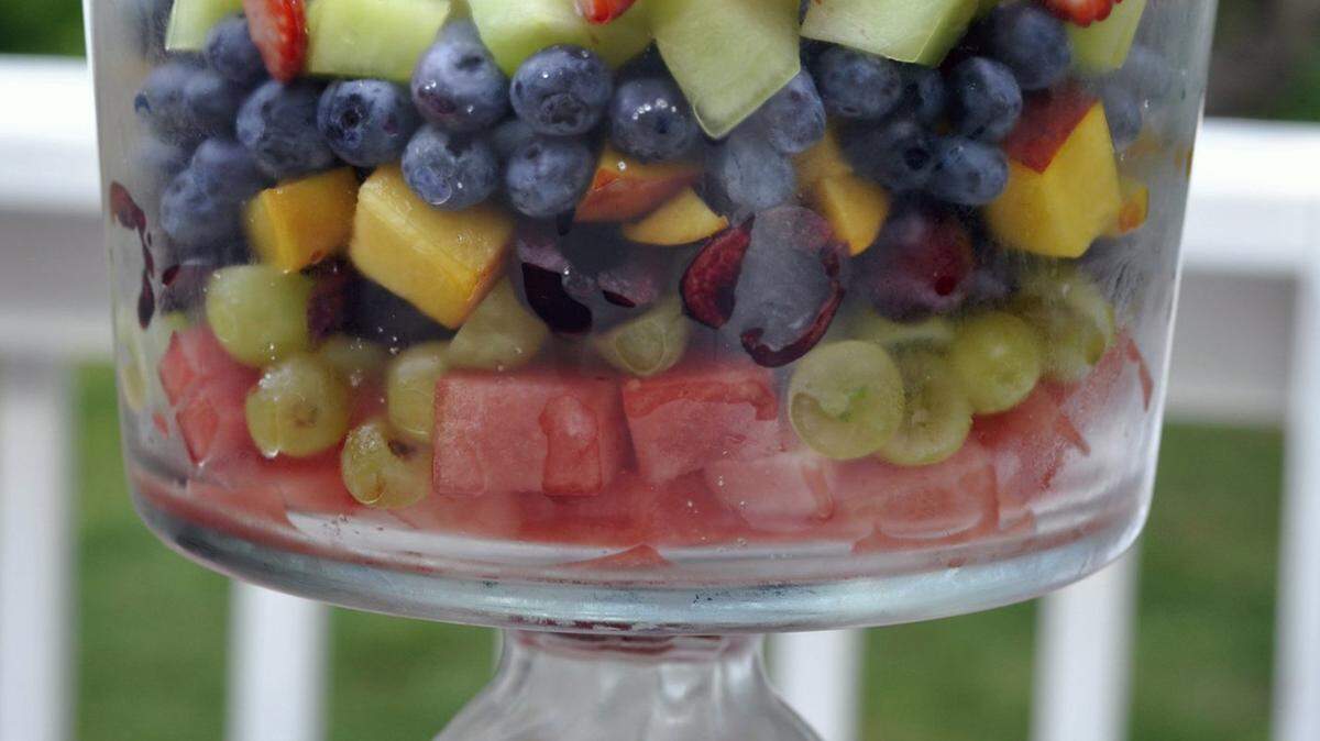 Fresh produce is displayed in a 7-Layer Fruit Salad.