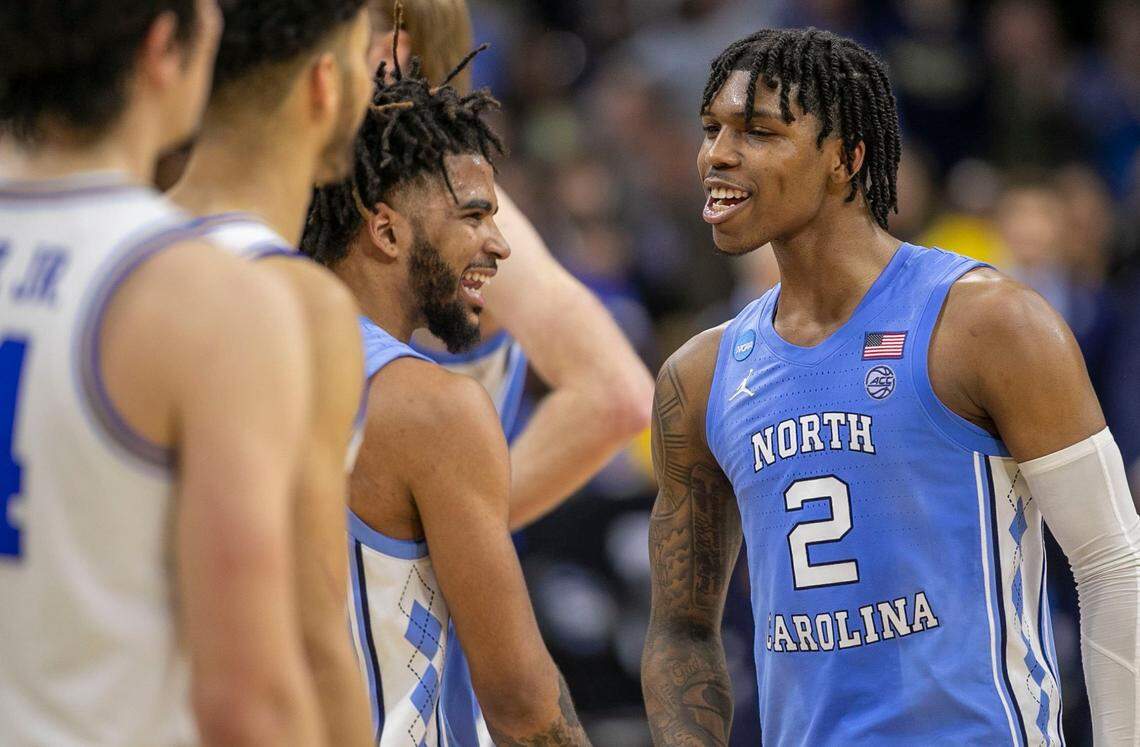 North Carolinas Caleb Love (2) and R.J. Davis (4) reacts as they secure the Tar Heels 73-66 victory over UCLA on Friday, March 25, 2022 during the NCAA East Regional semi-final at Wells Fargo Center in Philadelphia, Pa.