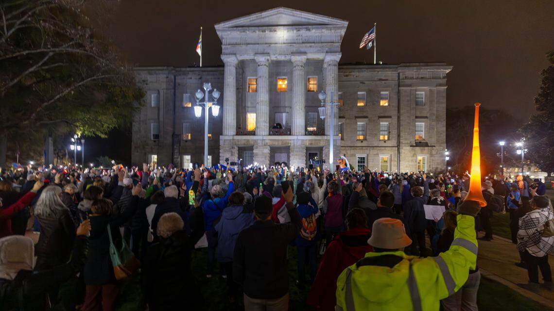 Demonstrators protest during a Moral Monday rally at the North Carolina State Capitol on Monday, Dec. 9, 2024, calling on lawmakers to uphold Gov. Roy Cooper’s veto of Senate Bill 382. Cooper vetoed the bill on Nov. 26, calling it “a sham” and criticizing its lack of hurricane relief and inclusion of various power grabs.