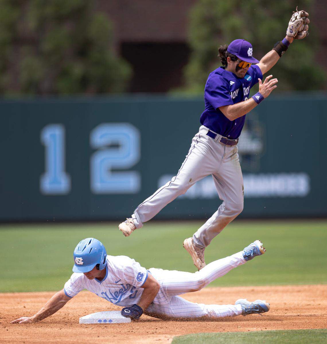North Carolina’s Kane Kepley (27) steals second base during their game against Holy Cross in the Chapel Hill Regional at Boshamer Stadium in Chapel Hill on Friday, May 30, 2025.