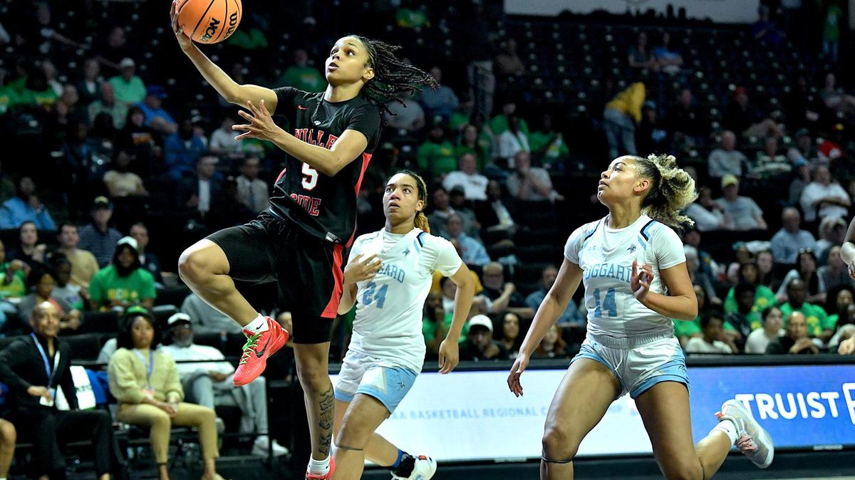 Rolesville’s Caitlyn Jones (5) attempts the layup ahead of Hoggard’s Tristan Shivers (14) and YaYa Graham (24) in the second half of the 4A East Regional Finals. Rolesville and Hoggard met in the NCHSAA 4A East Regional Championship game in Winston-Salem, N.C. on March 14, 2024.