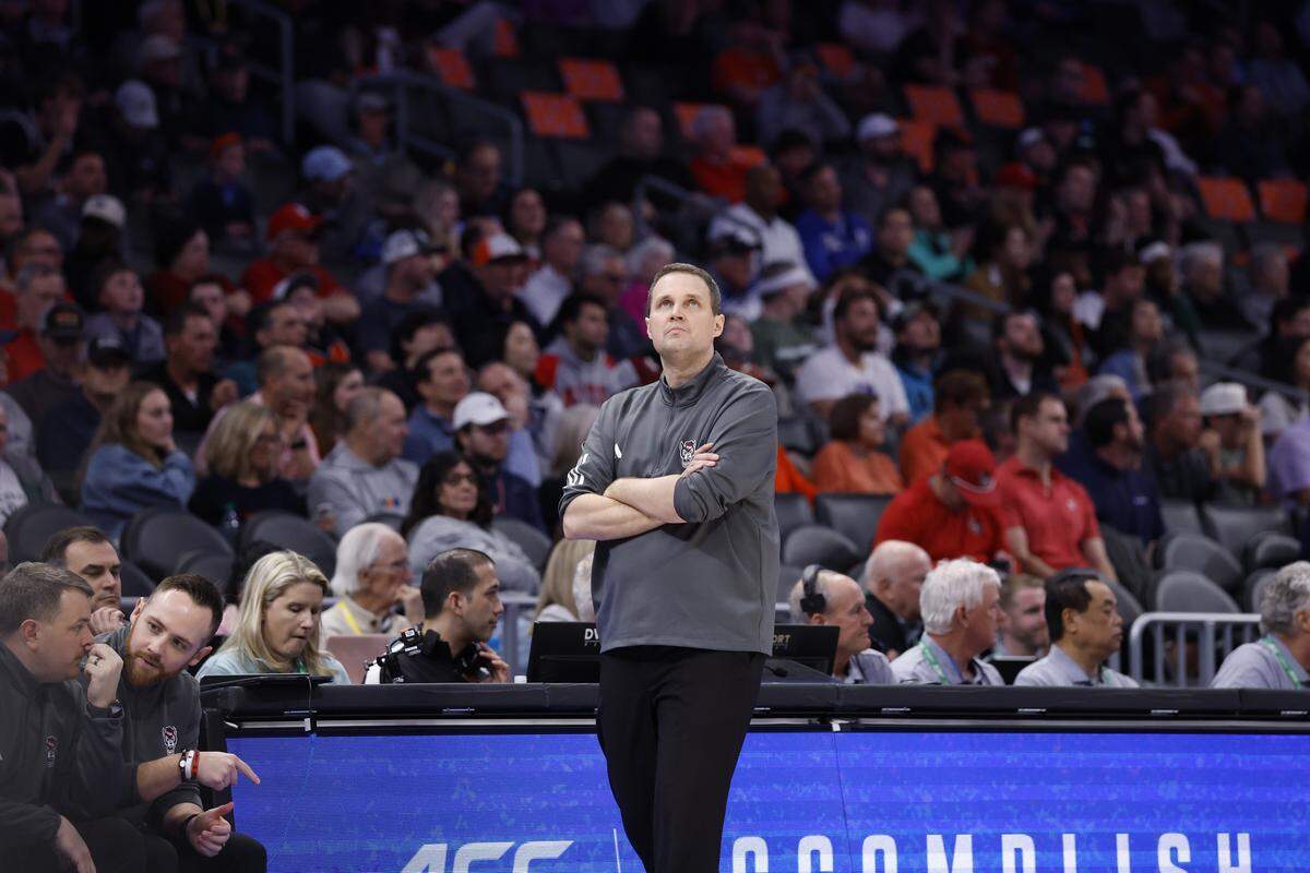 N.C. State head coach Will Wade looks up at the scoreboard in the second half of Virginia’s 81-74 victory over N.C. State in the quarterfinals of the 2026 ACC Men’s Basketball Tournament at the Spectrum Center in Charlotte, N.C., Thursday, March 12, 2026.