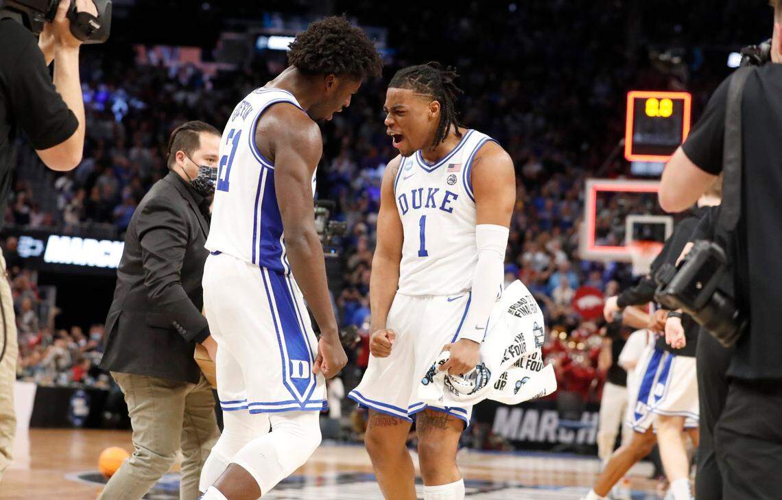 Dukes Trevor Keels (1) and AJ Griffin (21) celebrate after Dukes 78-69 victory over Arkansas in the NCAA Tournament West Regional finals at the Chase Center in San Francisco, Calif., Saturday, March 26, 2022.