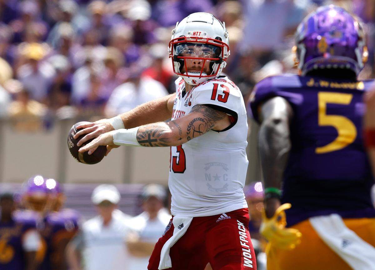 N.C. State quarterback Devin Leary (13) prepares to pass during the first half of N.C. State’s game against ECU at Dowdy-Ficklen Stadium in Greenville, N.C., Saturday, Sept. 3, 2022.