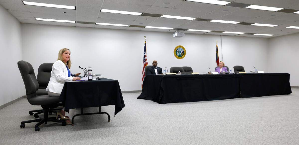 Ousted N.C. State Board of Elections Executive Director Karen Brinson Bell, left, makes a statement after the board adjourned their meeting in downtown Raleigh, N.C., on Wednesday, May 7, 2025. Brinson Bell asked to give farewell remarks before the meeting ended, but new Republican board member Bob Rucho moved to adjourn the meeting before she could do so. She stayed behind in the conference room to address the audience and the board’s two Democratic members, who did not leave after adjournment.