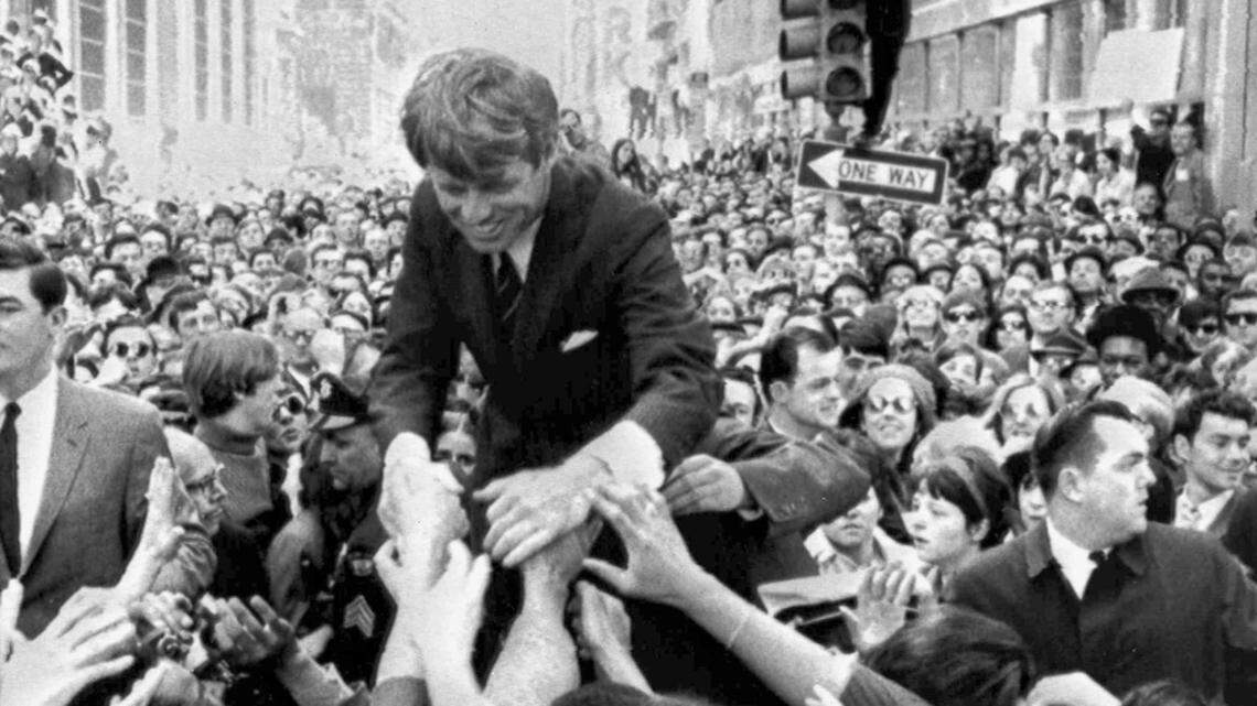 In this April 2, 1968, file photo Sen. Robert F. Kennedy, D-NY, shakes hands with people in a crowd while campaigning for the Democratic party's presidential nomination  in  Philadelphia.  The author has a copy of this photo in his office.