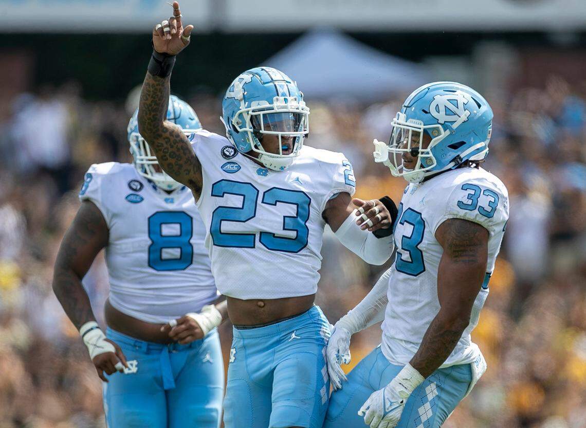 North Carolinas Power Echols (23) celebrates with teammate Cedric Gray (33), after Grays interception in the third quarter on Saturday, September 3, 2022 at Kidd Brewer Stadium in Boone, N.C.