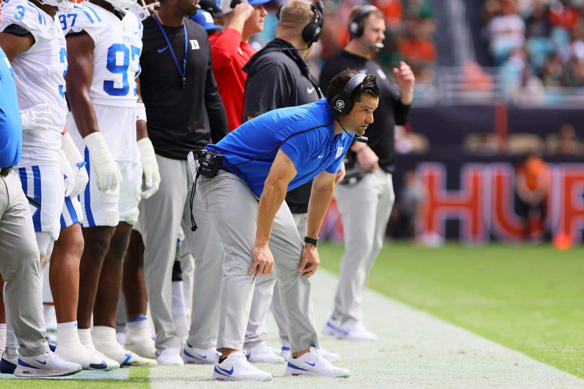 Nov 2, 2024; Miami Gardens, Florida, USA; Duke Blue Devils head coach Manny Diaz watches from the sideline against the Miami Hurricanes during the second quarter at Hard Rock Stadium.