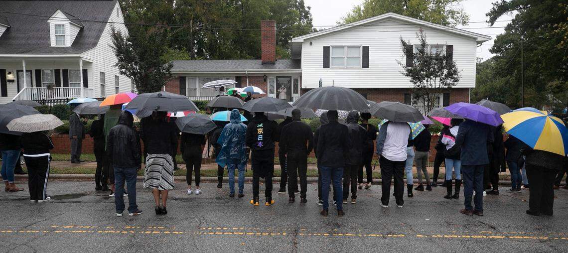 St. Augustine’s University Chaplain Rev. Hershey Mallette Stephens and Rev. Sallie Simpson, University Deacon, address a gathering of students and faculty outside President Irving McPhail’s home on Oakwood Ave. on Friday, October 16, 2020 in Raleigh, N.C.