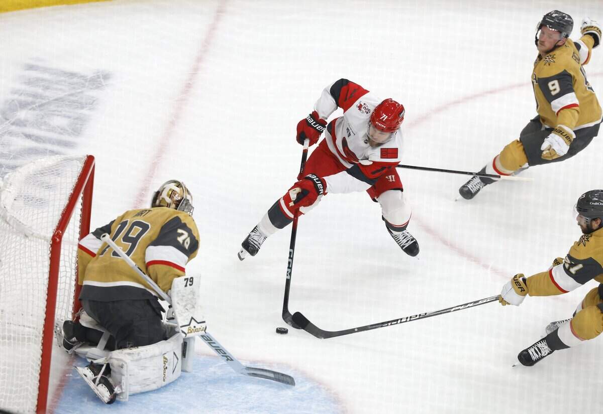 Vegas' Jack Eichel (9) hooks Carolina's Taylor Hall (71) as he prepares to shoot in the first period of the Hurricanes’ game against the Golden Knights in Game 6 of the Stanley Cup Final at T-Mobile Arena in Las Vegas, Nev., Sunday, June 14, 2026.