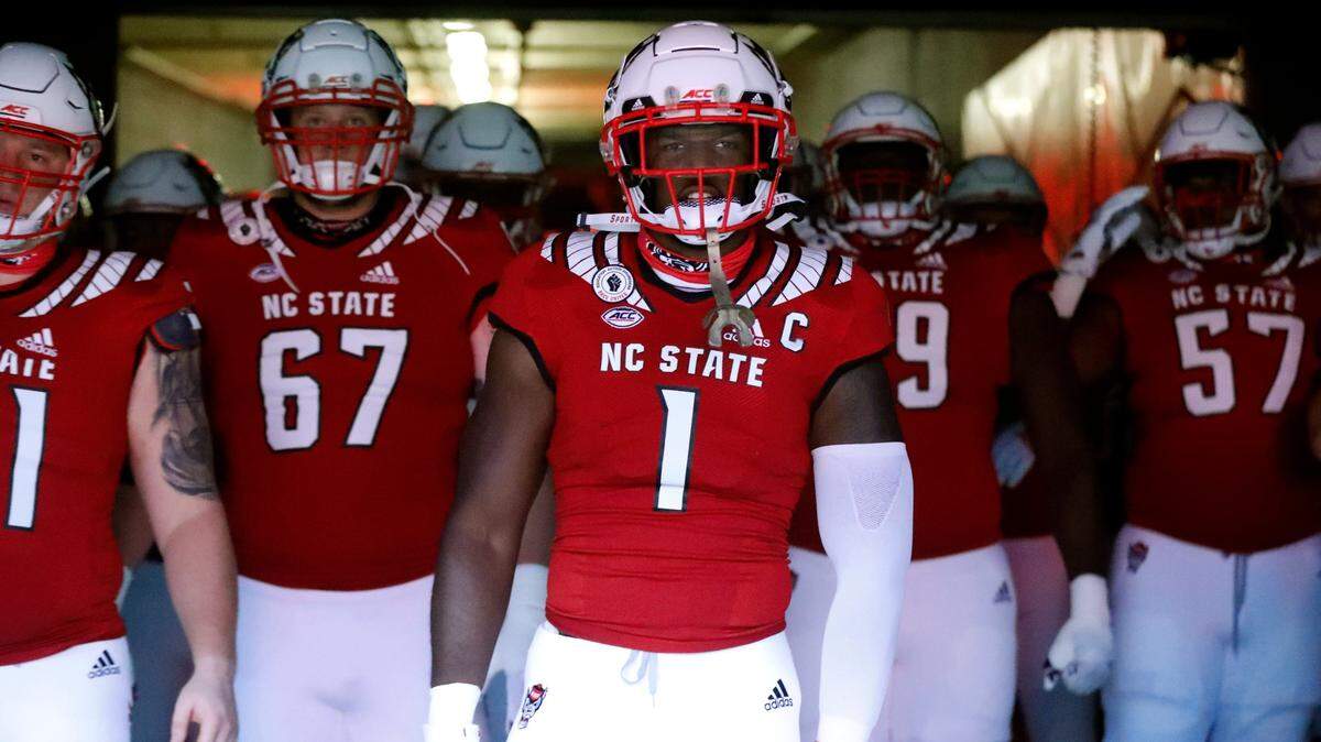 N.C. State linebacker Isaiah Moore (1) prepares to lead teammates out to the field to warm up before N.C. State’s game against Wake Forest at Carter-Finley Stadium in Raleigh, N.C, Saturday, Sept. 19, 2020.