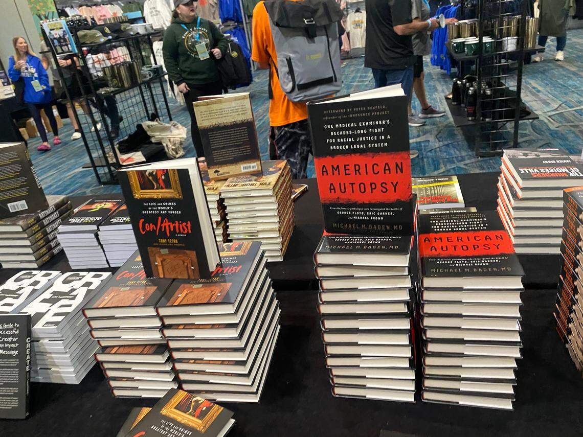 An array of true-crime books were for sale at the CrimeCon conference in Orlando, where lawyers involved in the murder trial of Alex Murdaugh appeared on Sept. 23, 2023.