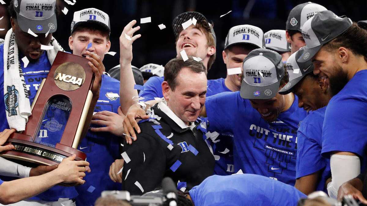 Dukeís Wendell Moore Jr. hugs coach Mike Krzyzewski after Dukeís 78-69 victory over Arkansas in the NCAA Tournament West Regional finals at the Chase Center in San Francisco, Calif., Saturday, March 26, 2022.