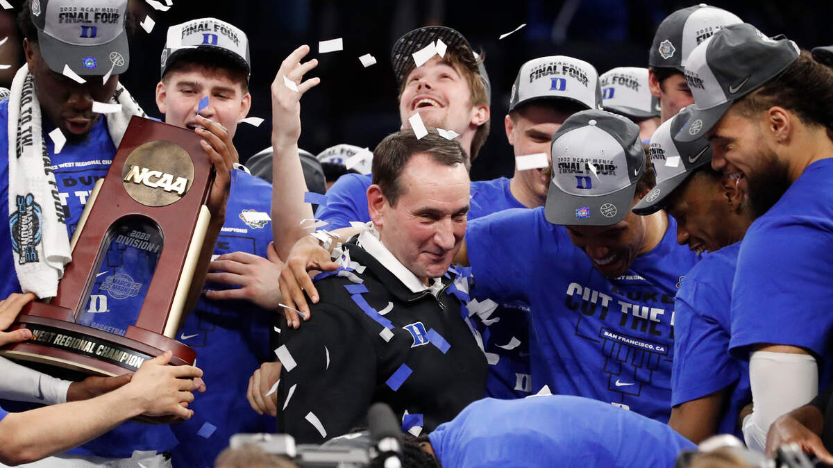 Dukeís Wendell Moore Jr. hugs coach Mike Krzyzewski after Dukeís 78-69 victory over Arkansas in the NCAA Tournament West Regional finals at the Chase Center in San Francisco, Calif., Saturday, March 26, 2022.