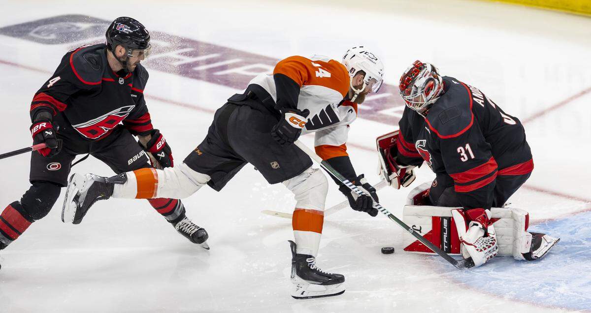 Carolina Hurricanes goalie Frederik Andersen (31) stops a scoring attempt by Philadelphia center Sean Couturier (14) in the third period of Game 1 on Saturday, May 2, 2026, during the second round of the Stanley Cup Playoffs at Lenovo Center in Raleigh, N.C.  Andersen stopped 19 shots on goal in the Hurricanes’ 3-0 victory.
