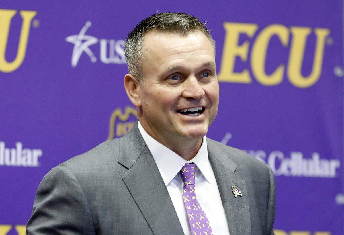 East Carolina football coach Mike Houston speaks after being introduced during a press conference at the Murphy Center at East Carolina University in Greenville, N.C., Tuesday, Dec. 4, 2018.