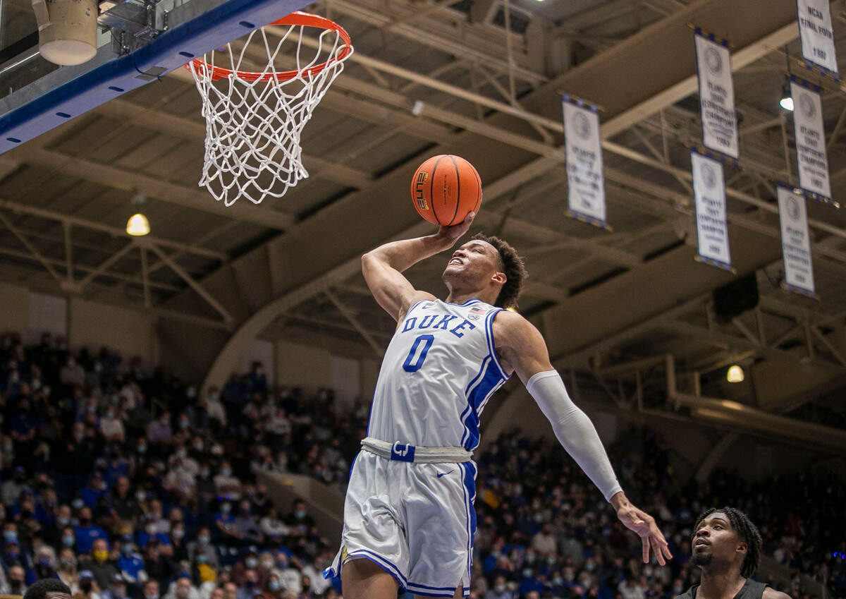 Duke’s Wendell Moore Jr. (0) soars to the basket for a dunk in the second half against Appalachian State on Wednesday, Thursday 16, 2021 at Cameron Indoor Stadium in Durham, N.C. Moore Jr. lead all scores with 21 point in the Blue Devils’ 92-67 victory.