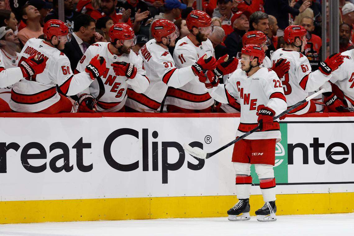 May 6, 2025; Washington, District of Columbia, USA; Carolina Hurricanes center Logan Stankoven (22) celebrates with teammates after scoring a goal against the Washington Capitals in the third period in game one of the second round of the 2025 Stanley Cup Playoffs at Capital One Arena. Mandatory Credit: Geoff Burke-Imagn Images