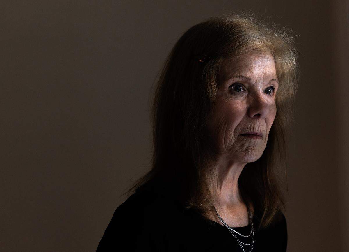 Jill Rohner poses for a portrait at her former home on Wednesday, May 21, 2025, in Raleigh, N.C. Rohner’s partner was fatally shot by her ex-husband, against whom she had a domestic violence protective order, at the home in late January. Her ex-husband shot at responding police from inside the home, and they returned fire, killing him. 