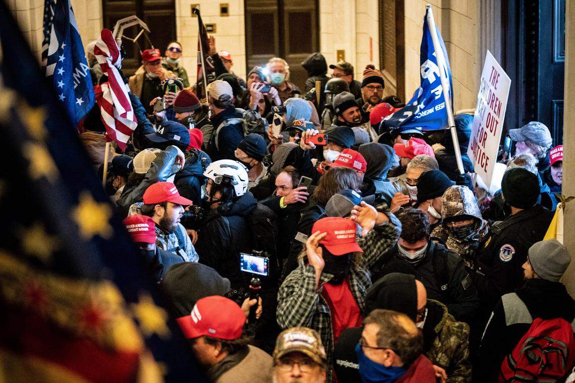 A pro-Trump mob storms the Capitol in Washington, Wednesday, Jan. 6, 2021. Trump loyalists earned money by broadcasting their storming of the Capitol on a streaming site called Dlive, which is benefiting from the growing exodus of right-wing users from Twitter, Facebook and YouTube.