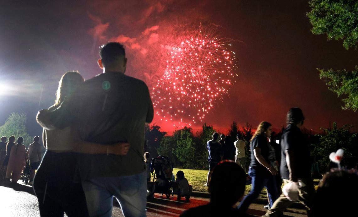 Those leaving Dorothea Dix Park stop and watch an abbreviated fireworks show from Hunt Drive Thursday, July 4, 2024.