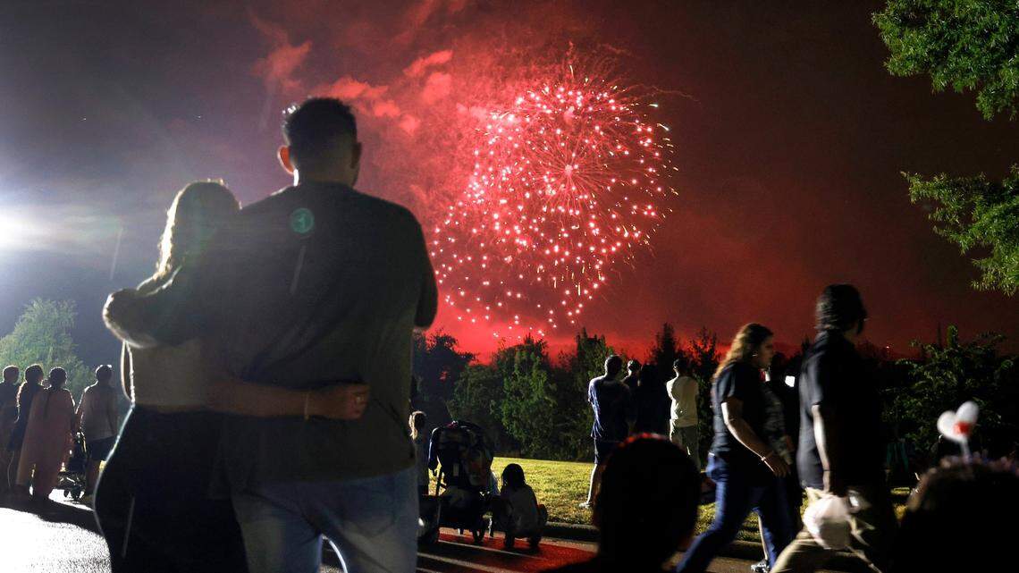 Those leaving Dorothea Dix Park stop and watch an abbreviated fireworks show from Hunt Drive Thursday, July 4, 2024.