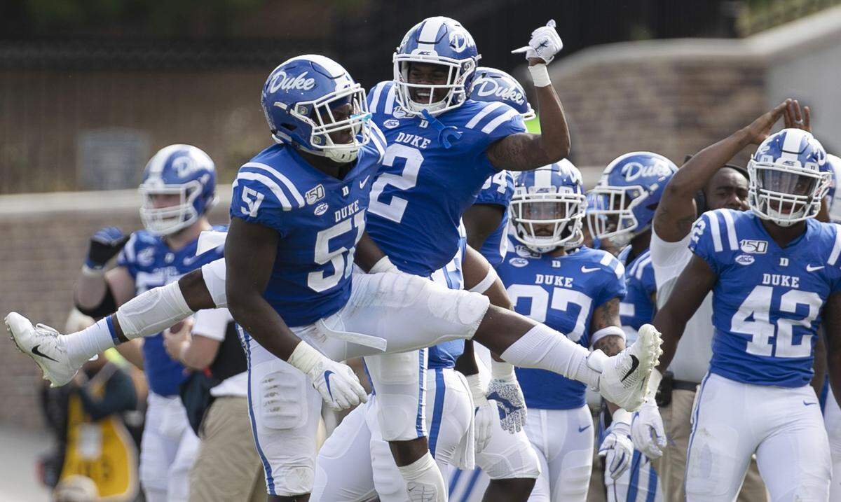 Duke’s Victor Dimukeje (51) celebrates with teammate Javon Jackson (2) after a defensive stop of Georgia Tech on fourth down in the third quarter on Saturday October 12, 2019 at Wallace Wade Stadium in Durham, N.C.